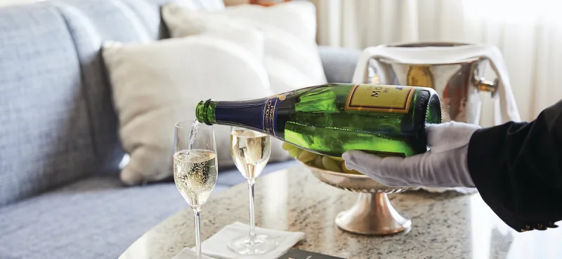 Butler serving champagne, Silver Wind